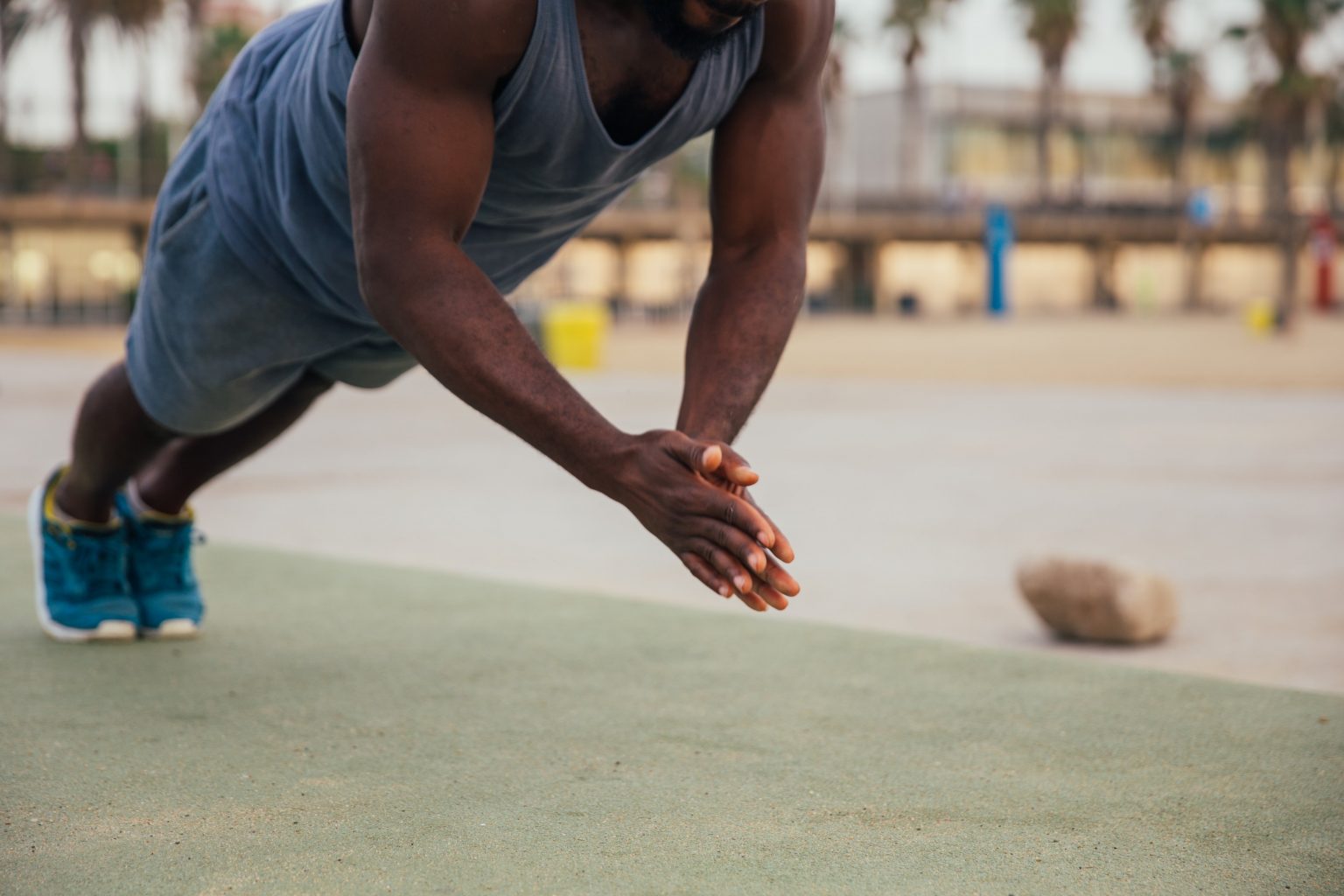 Person doing. Clap Push ups. African man strong Arms.