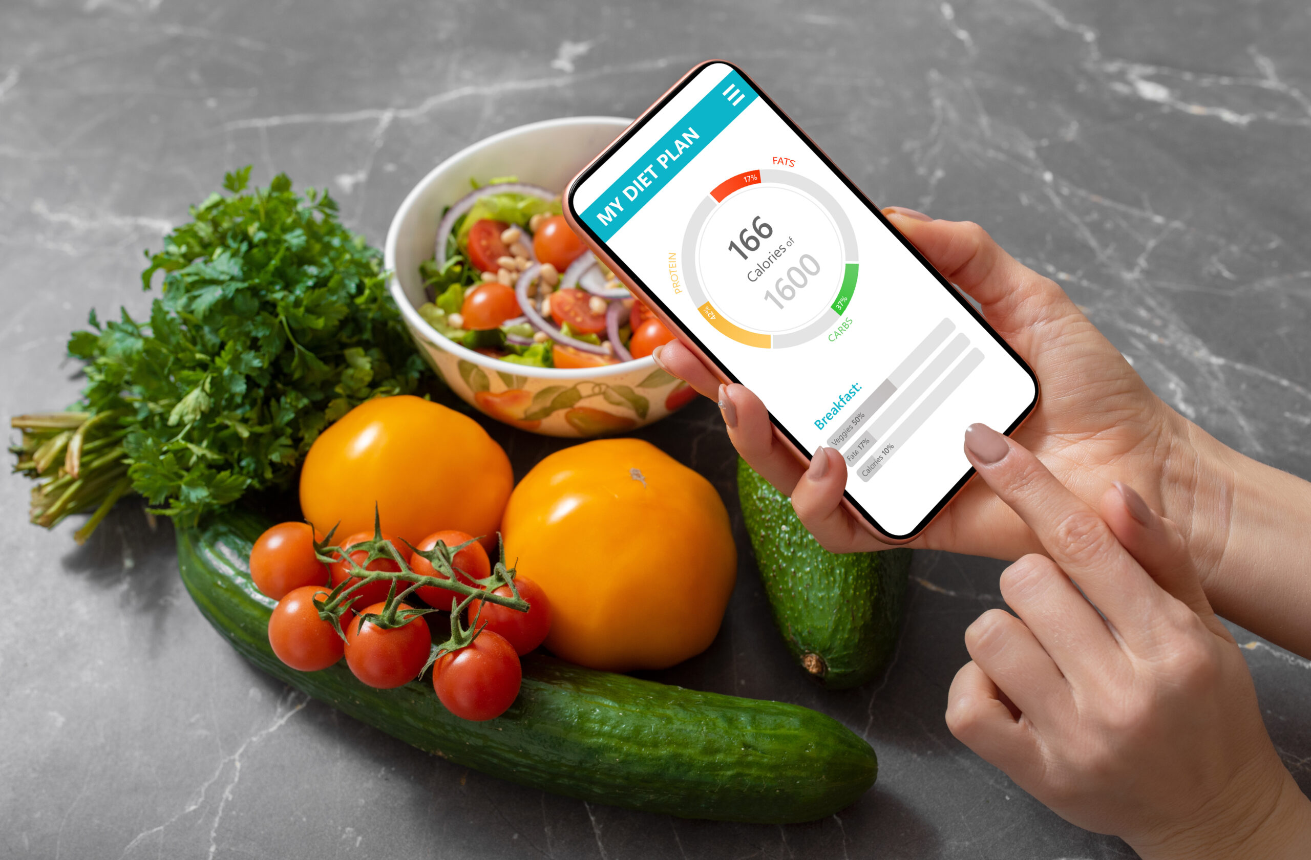 Woman using dieting app to track nutrition facts and calories in her food