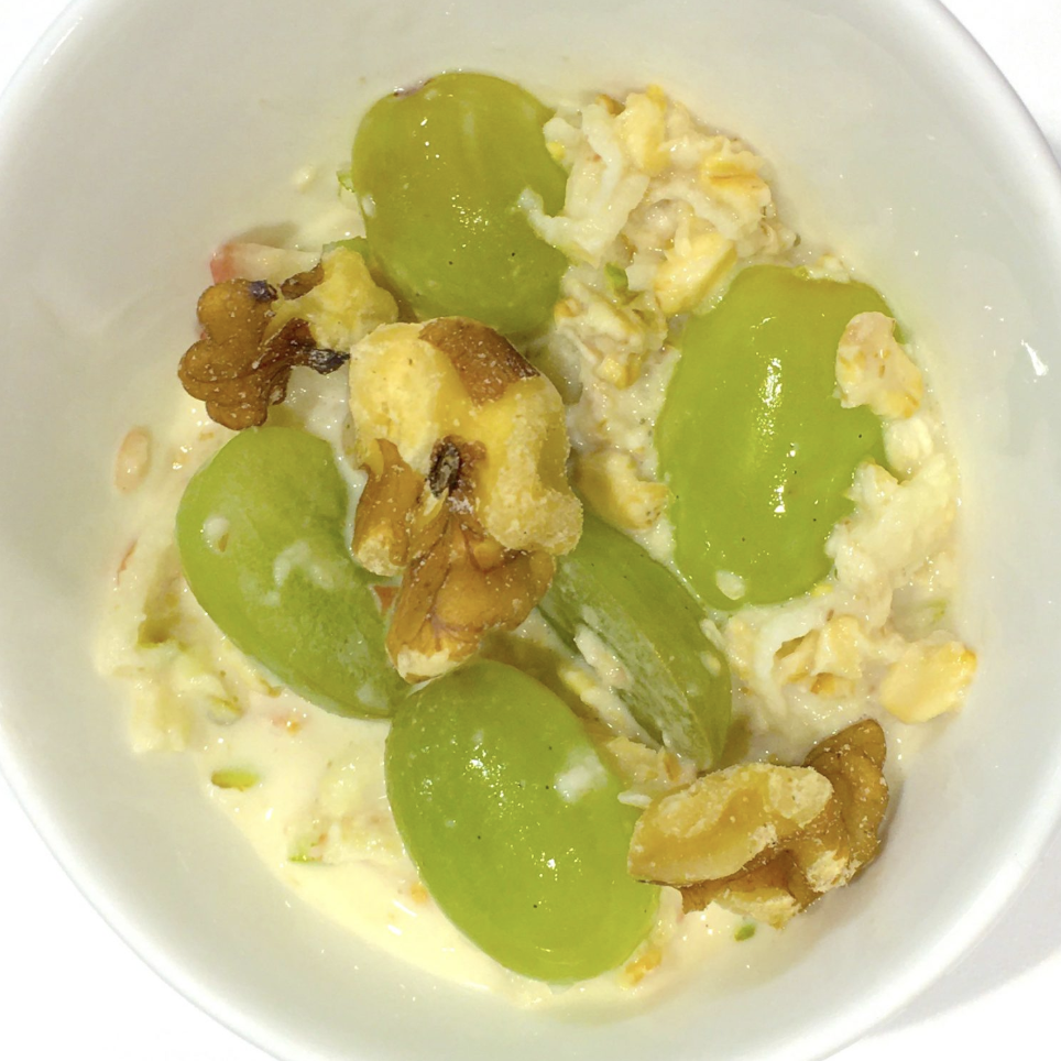 Small bowl of Med Morning Museli with grape halves.
